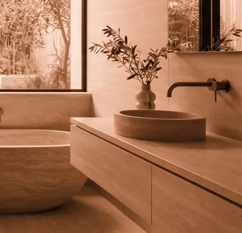 Round Rondo washbasin in satin terracotta on a worktop